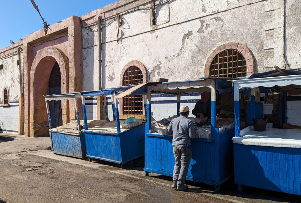 Fish stands lining the harbor